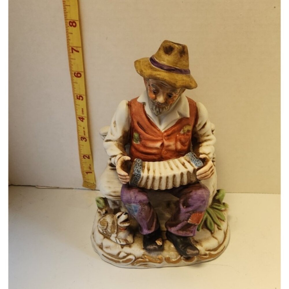 Figurine Ceramic Old Man Playing Accordion On Bench Dog Vintage